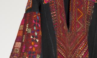Black dress with pink and red embroidery on