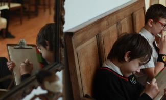 students drawing in the kettle's Yard House museum 