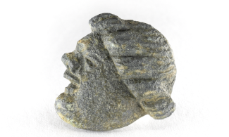 Copper alloy strap slide in the shape of a person's head