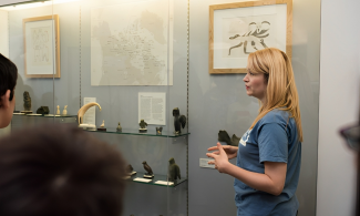 Staff at Polar Museum talking about objects on display