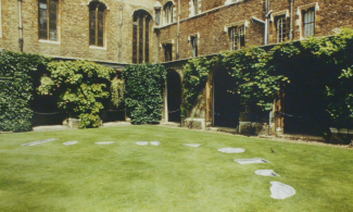 Veronica Ryan, Cavities in the Cloister Court (1988). Lead lawn installation at Jesus College, Cambridge, UK.