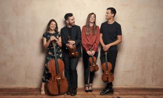 A group of people holding instruments