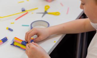 A child playing with craft materials