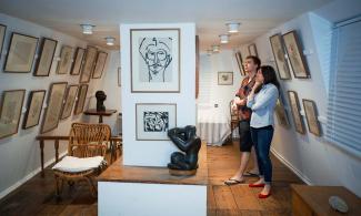 Two people looking at art
