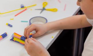 Visitor enjoying art activity. Photo by Josh Murfitt