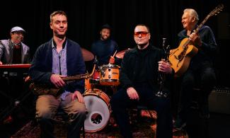 ' Might Like the Blues' jazz band with their instruments.