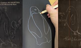 On the left is a chalkboard sketch of a penguin signed by Captain Robert Falcon Scott and dated 1 December 1904. In the middle is a sketch of a penguin on black paper using a white pencil crayon. On the right is a rounded sketch of a penguin with the text "This is a penguin?" signed by Sir Ernest Shackleton. 