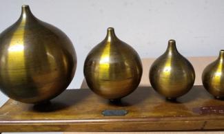 A set of helmholtz resonators, metal objects which look like large onions