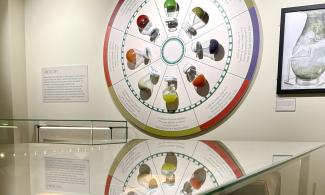 Multicoloured urine flasks mounted on a display wheel with information about their meaningsMulticoloured urine flasks mounted on a display wheel with information about their meanings