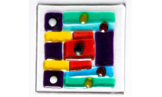 A bright and colourful piece of fused glass.