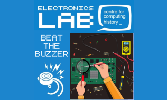 Soldering equipment being used to build a wire maze game