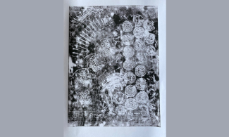 black and white printed image that a child has done using various objects