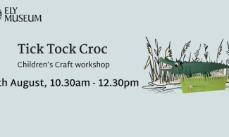 An image of the crocodile that will be made with some drawn grass behind it.  It's on a pale blue background with the words Tick Tock Croc