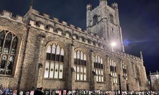 The exterior of Great St Mary’s church at night.
