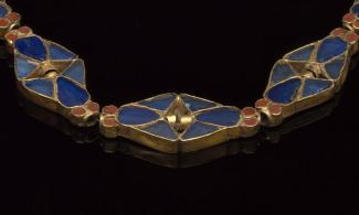 Image of a gold, blue and red Egyptian necklace