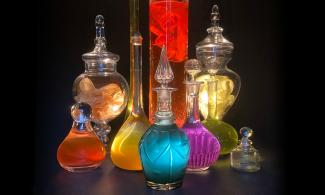 Image showing different sized elegant glass jars with colourful inks and dyes 