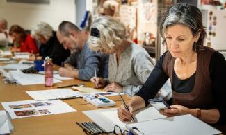 Photo of participants engaged in an art workshop 