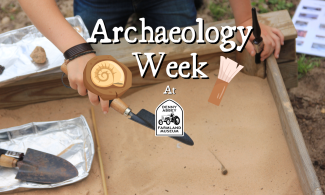 Background image shows sandpit and archaeology tools. Foreground reads "archaeology week" with Denny Abbey and the Farmland Museum logo