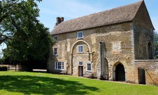 Image shows Denny Abbey and a walnut tree.