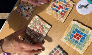 Example of mosaic coasters and parents hands