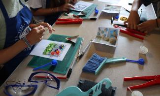 A table showing glass fusing equipment.