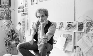 Man sat in photography studio