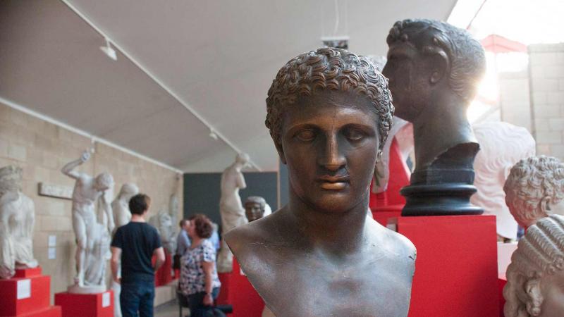 people exploring the casts inside the museum