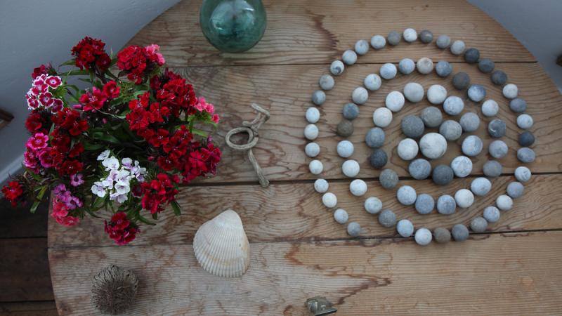 Spiral of Stones is an arrangement of 76 circular pebbles, carefully positioned by the creator of Kettle’s Yard Jim Ede.