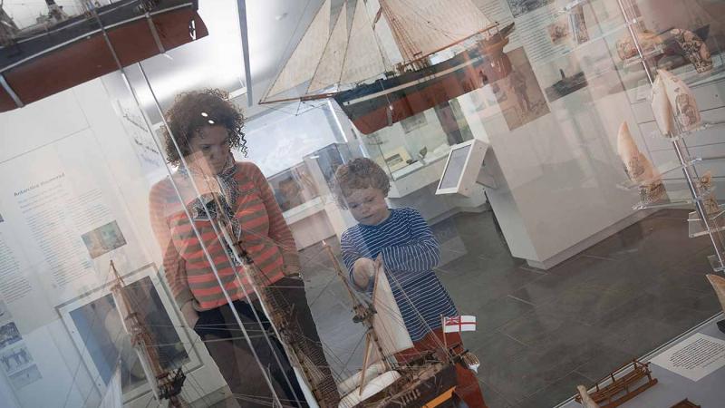 Visitors looking at exhibits
