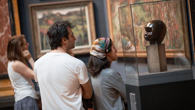 Visitors looking at art