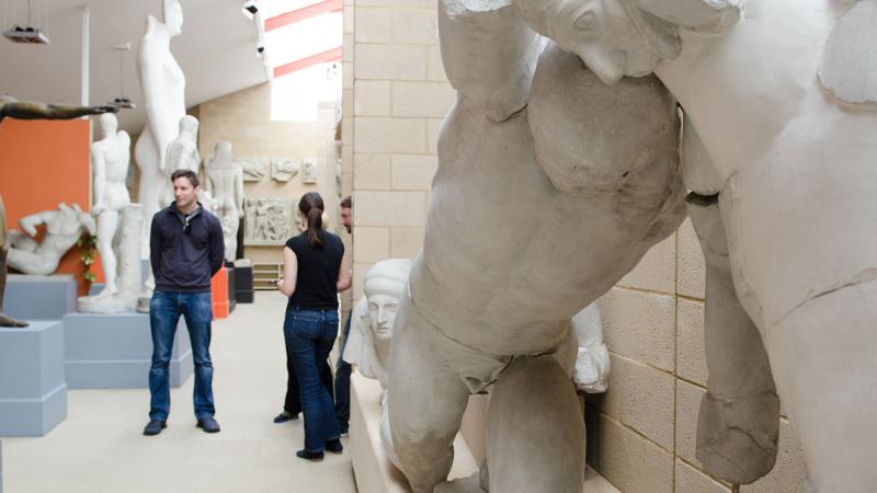 people exploring the casts inside the museum