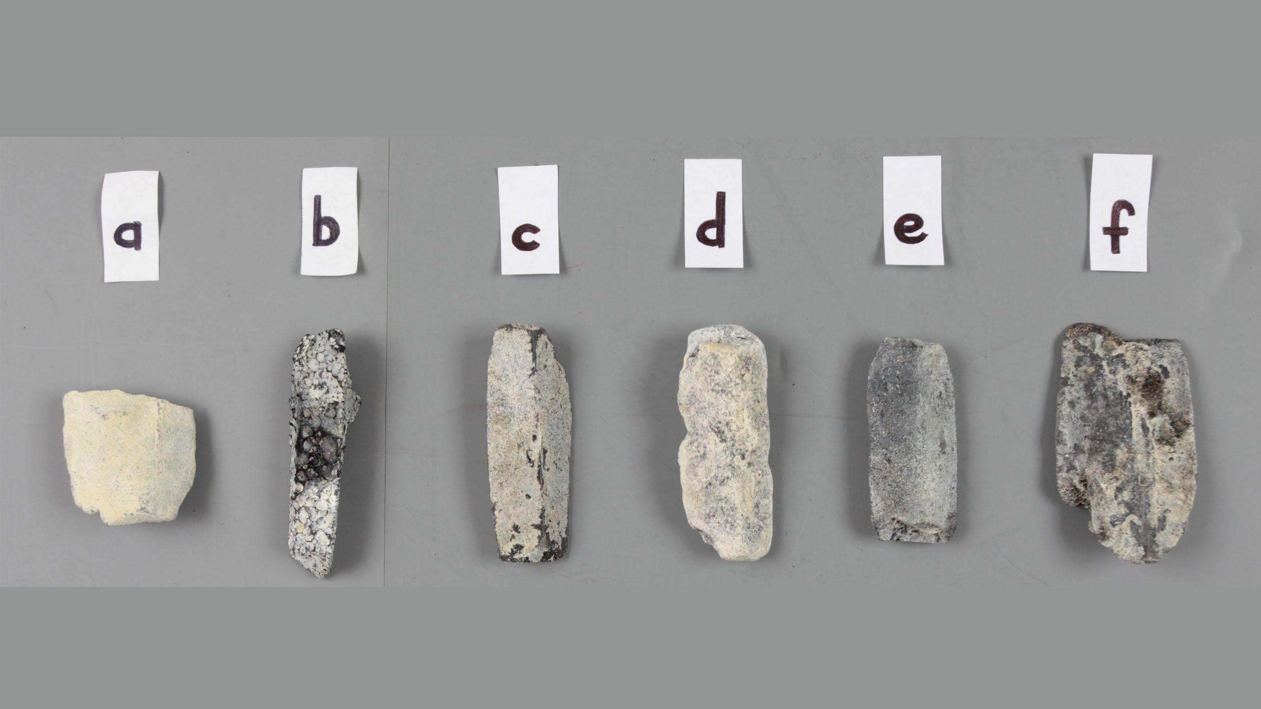 six rock samples accompanied by labels: a, b, c, d, e, f