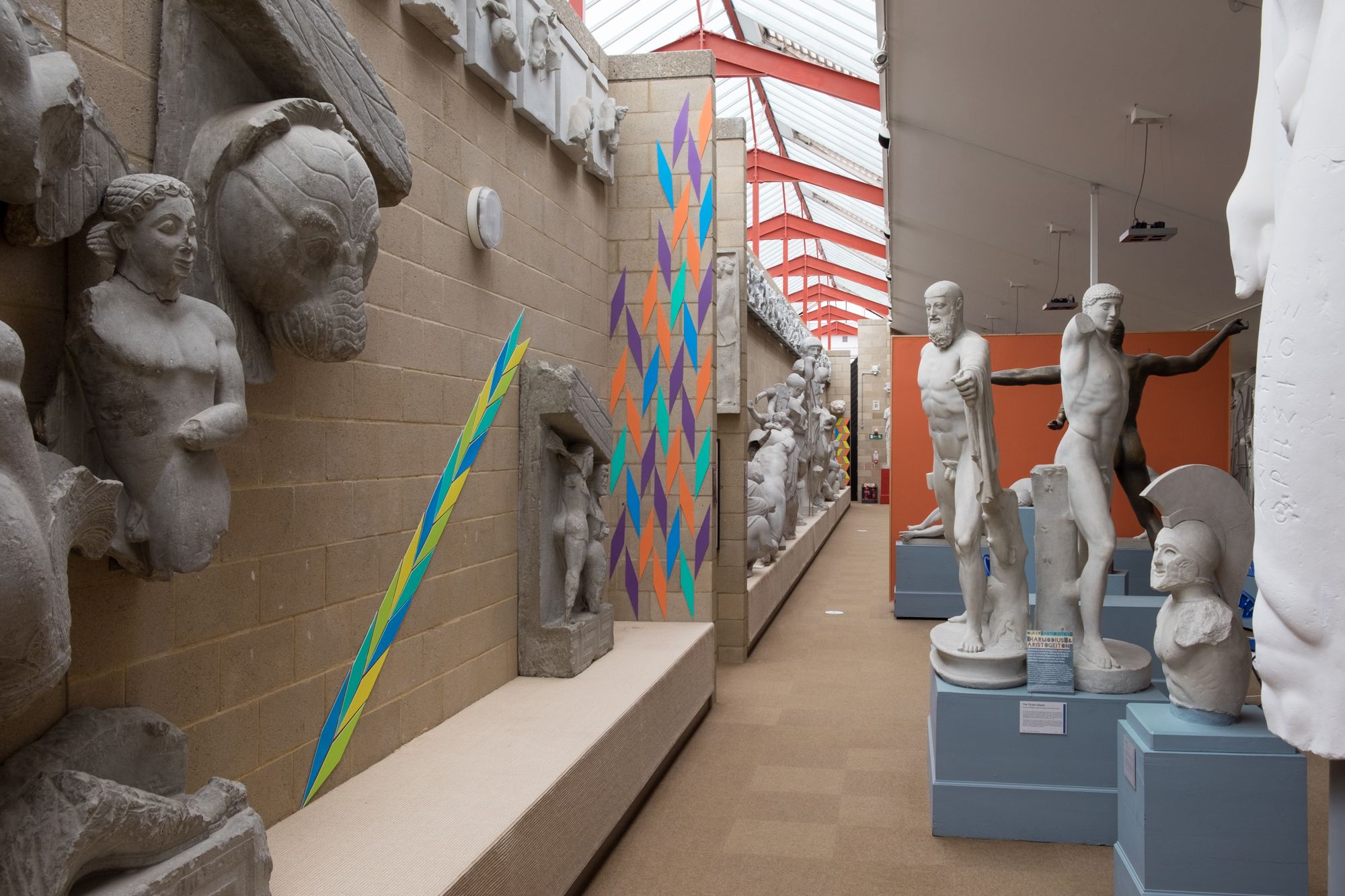 A view down the gallery, James colourful works appear at intervals along the way