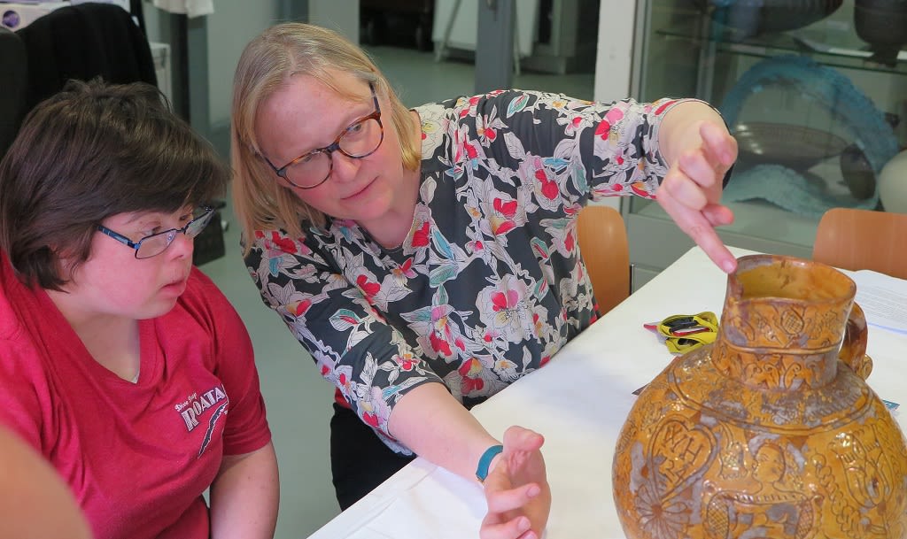 Fitzwilliam Museum Keeper of Applied Arts discusses the Devon harvest jug with a Rowan art student