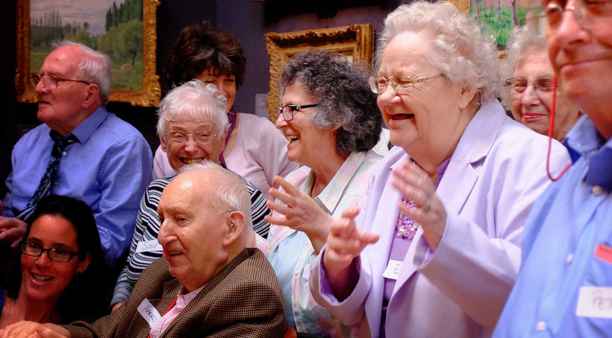Old people smiling and moving in the Fitzwilliam Museum